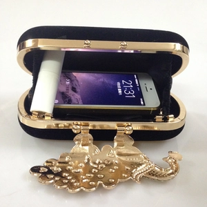 Internal view of velvet evening clutch bag showing space for phone and lipstick