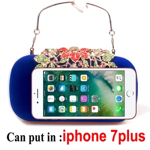 Detail showing royal blue velvet evening bag capacity fitting a large smartphone
