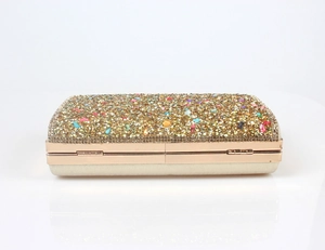 Detail of mermaid rhinestone clutch with colorful crystals and gold metal frame