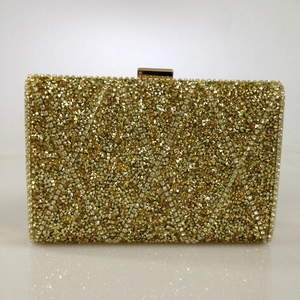 Detailed front view of gold encrusted evening clutch with sparkling rhinestones and metal clasp