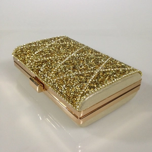Elegant gold rhinestone evening clutch bag with rose gold metal frame for formal events