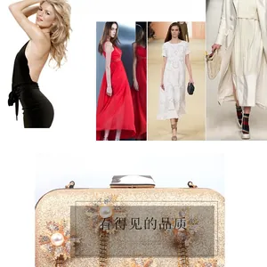 Detail of gold evening clutch with pearl flower decor and metallic fringe tassels