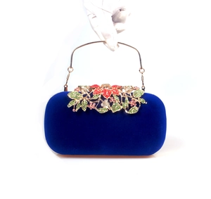 Deep royal blue velvet clutch bag with crystal leaf flower clasp and gold ring handle