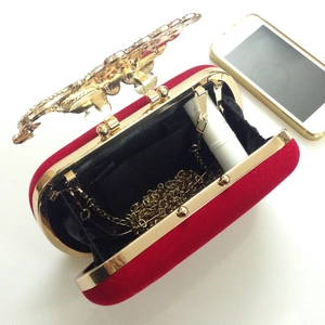 Elegant red velvet evening bag with gold dragon clasp and chain strap for parties