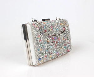 Side view of luxury rhinestone evening bag with colorful crystals and silver metal frame
