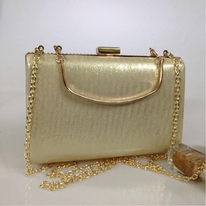 Elegant gold sequin evening clutch bag with metal frame and chain shoulder strap