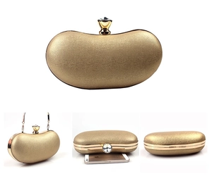 Detailed views of gold bean evening clutch with crystal crown clasp and phone size comparison