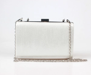 Silver satin clutch bag with fine metal chain strap and sleek top lock detail