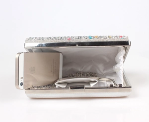 Detail showing inner capacity of mermaid rhinestone evening clutch with silver chain