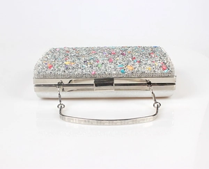 Detailed view of silver mermaid evening bag with colorful crystals and rhinestones