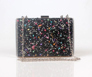 Detailed shot of rectangle clutch bag with black crystals and colorful rhinestones