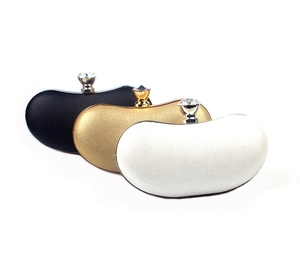 Three elegant evening clutch bags in black, gold and silver with crystal clasps