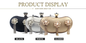Detail of luxury evening bags with pearl floral rhinestones and long tassels in three colors