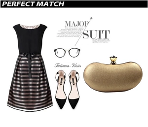 Gold metallic clutch bag with crystal clasp paired with a chic evening party outfit