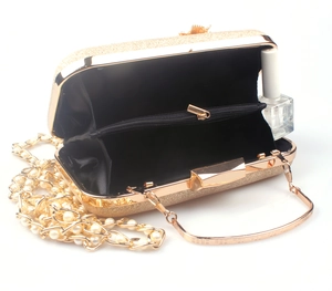 Golden glitter evening clutch bag with metal handle and pearl chain strap for women