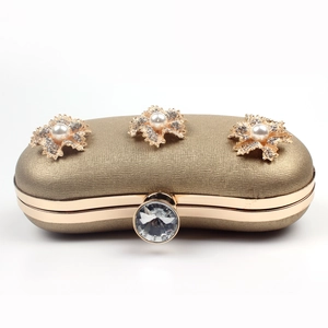 Elegant champagne gold floral clutch bag with pearls and rhinestones for evening parties