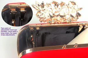Detail showing internal metal hooks of the red velvet evening clutch for chain attachment
