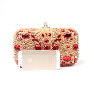 Handmade gold beaded evening clutch bag with red crystals and phone size comparison