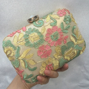 Elegant floral embroidery evening clutch bag with golden spherical clasp for formal events