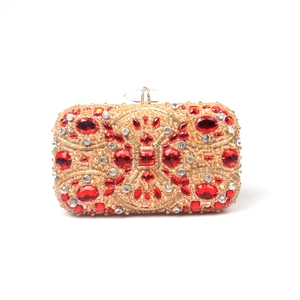 Front detail of gold beaded clutch bag with luxury red crystals and floral rhinestone patterns