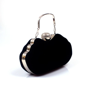 Elegant black velvet evening clutch bag with wave design and rhinestone sphere clasp