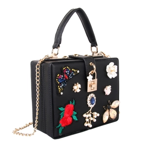 Luxurious black evening clutch featuring butterfly embroidery, pearls, and floral rhinestones