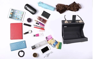 Interior view of black butterfly clutch showing large capacity for essentials and tablet