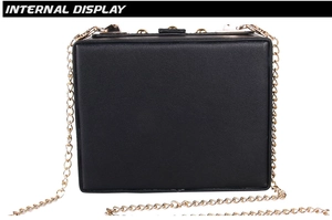 Internal view of black square butterfly embroidery evening bag with gold chain strap