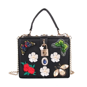 Elegant black evening handbag with butterfly embroidery, pearls and rhinestones on the cover