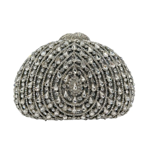 Detailed macro view of radiant crystal rhinestones and hollow structure on luxury clutch