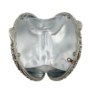 Silver fan-shaped crystal clutch bag with interior view showing sparkly rhinestone finish
