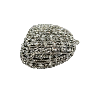 Macro detail of luxury fan-shaped clutch bag with sparkling rhinestone and crystal inlays