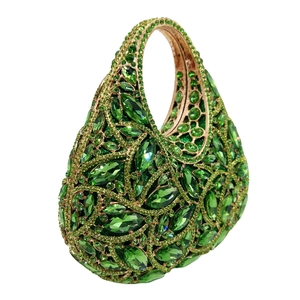Close-up of luxury green crystal evening clutch with emerald marquise rhinestones