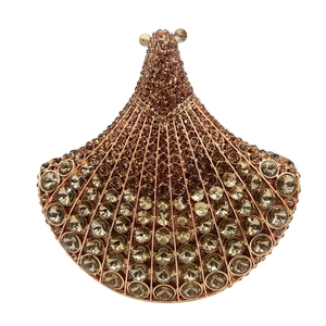 Macro detail of luxury fan-shaped evening clutch bag with sparkling crystal rhinestones