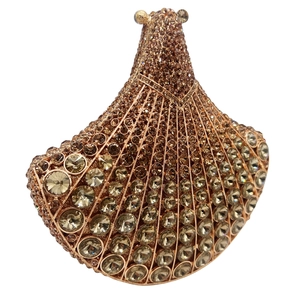 Macro detail of fan-shaped evening clutch bag with sparkling champagne rhinestones
