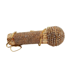 Detail of microphone shaped evening clutch with sparkling champagne crystals and chain