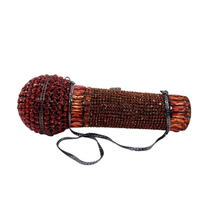 Exquisite microphone-shaped evening clutch bag with red and amber crystals and a chain