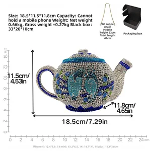 Detail view of teapot-shaped evening bag with blue crystals and flat copper chain strap