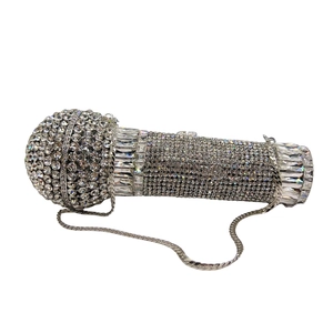 Detailed close-up of microphone shaped clutch bag with sparkling rhinestone crystals