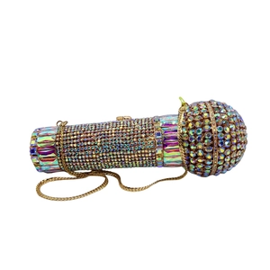 Detail of luxury microphone-shaped clutch bag with sparkling AB rhinestones and gold chain