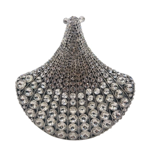Detail view of the silver fan-shaped clutch bag showing intricate rhinestone hand-setting
