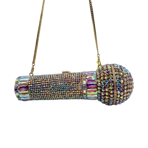 Detailed close-up of a microphone-shaped clutch bag with sparkling crystal rhinestones