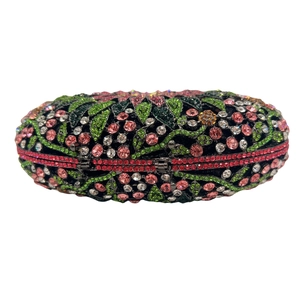 Detail of floral crystal evening clutch with pink and green rhinestones on black frame