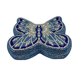 Detailed macro view of the butterfly clutch bag with blue and white gradient rhinestones
