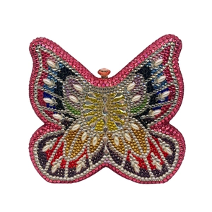 Detailed front view of butterfly clutch bag with rainbow rhinestones and pearl accents