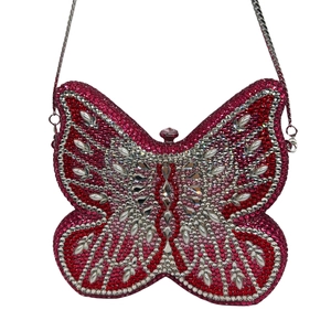 Detail of butterfly clutch bag with pink and silver crystals and fine metal chain
