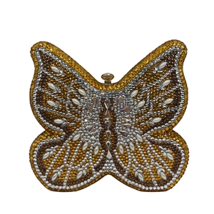 Detail of butterfly evening clutch bag with gold and coffee crystal rhinestones