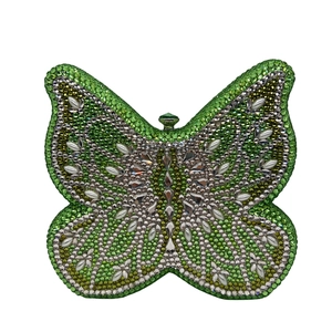 Detailed view of the green crystal butterfly clutch bag featuring high-end rhinestones