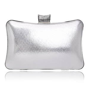 Detailed view of silver evening clutch featuring a rectangular crystal-encrusted clasp