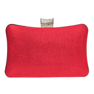 Elegant red glitter clutch bag with rectangular gold rhinestone clasp and metal frame